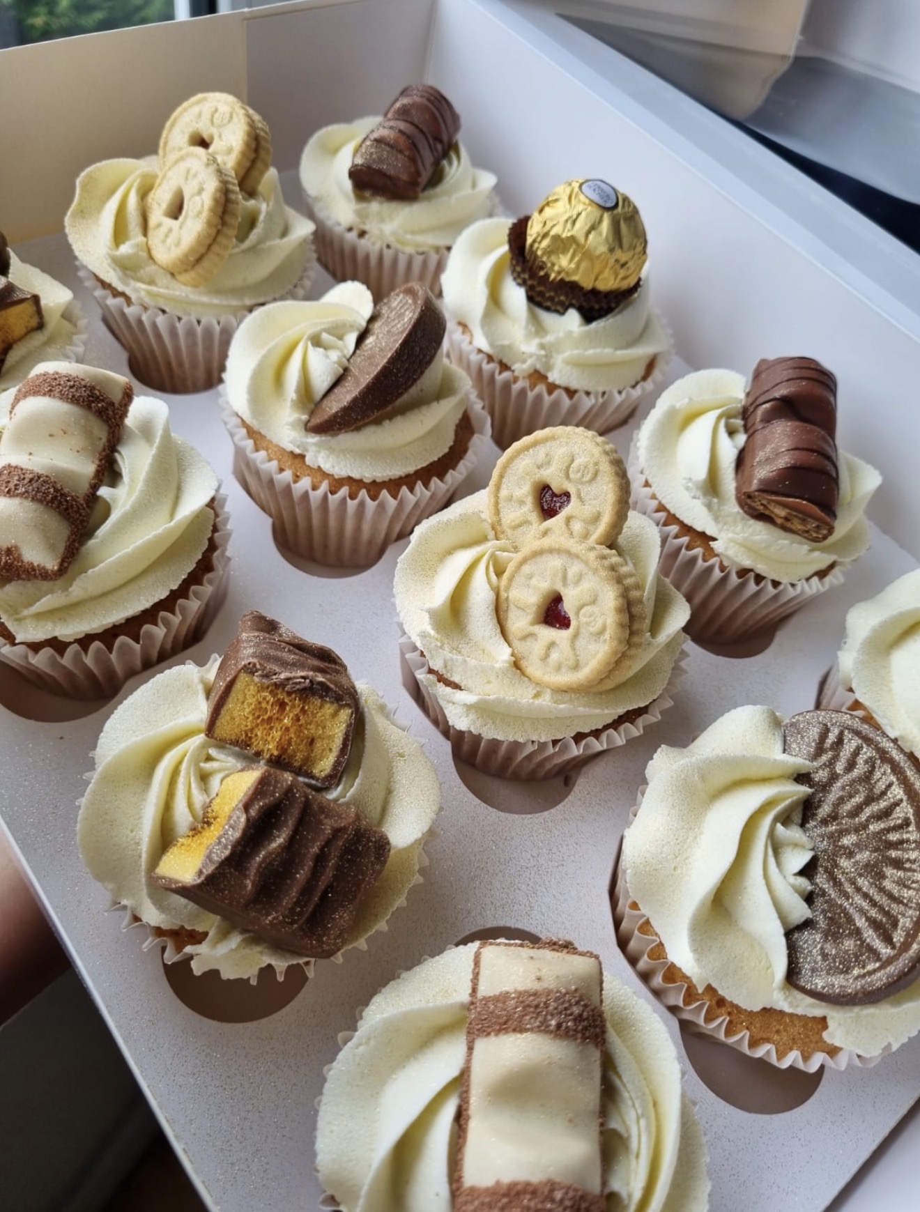 Luxury cupcakes with assorted chocolate toppings