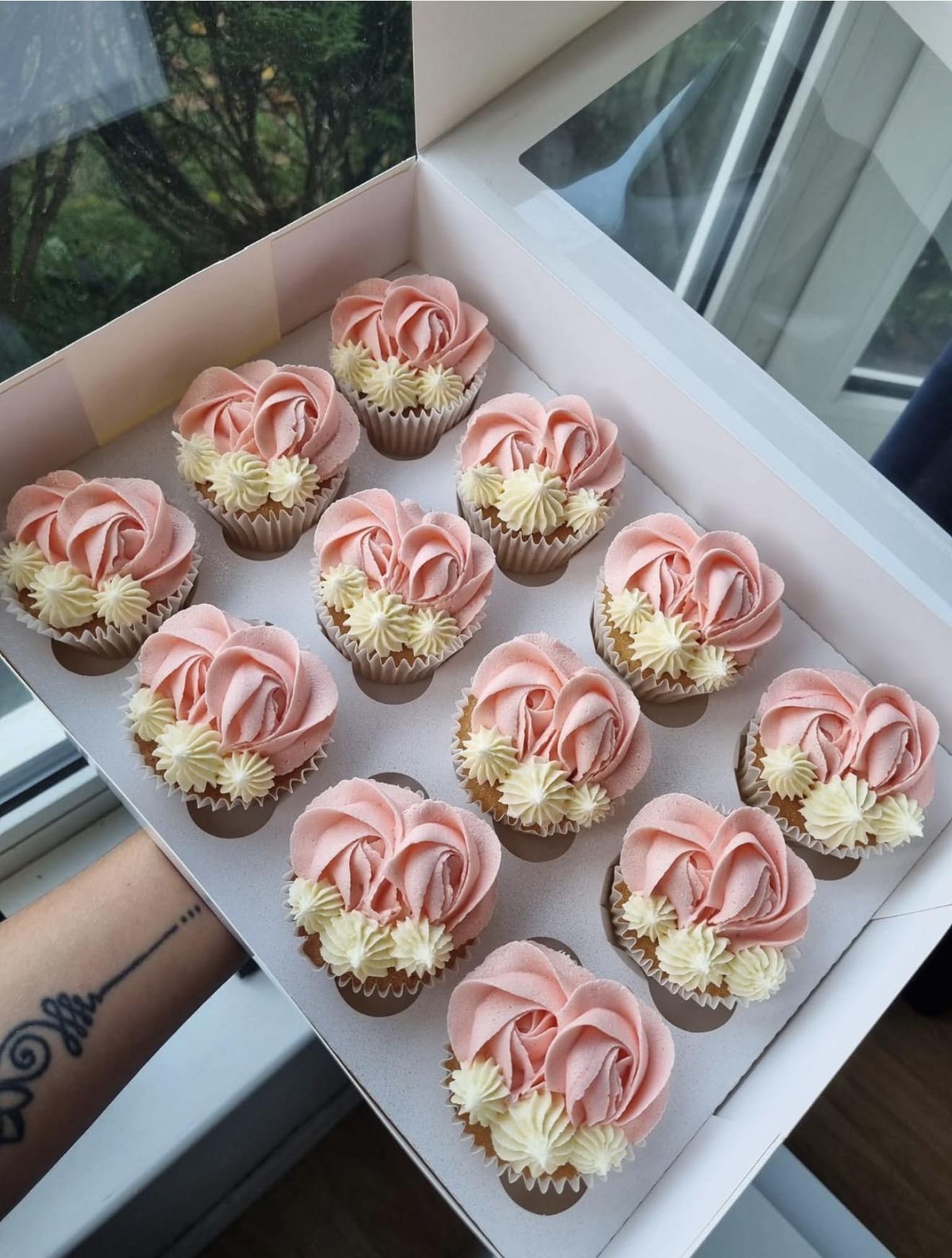 Luxury cupcakes with pink and white piping